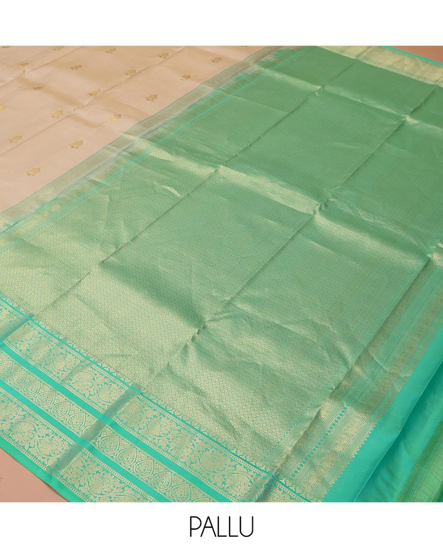 Sandal Vasundhara Silk Saree, Woven with Zari Buttas All Over Its Body, Complemented by a Contrast Border of Jada Nagam, and Kodi Visiry Designs, Intricately Designed Pallu, and Paired with a Contrast Blouse