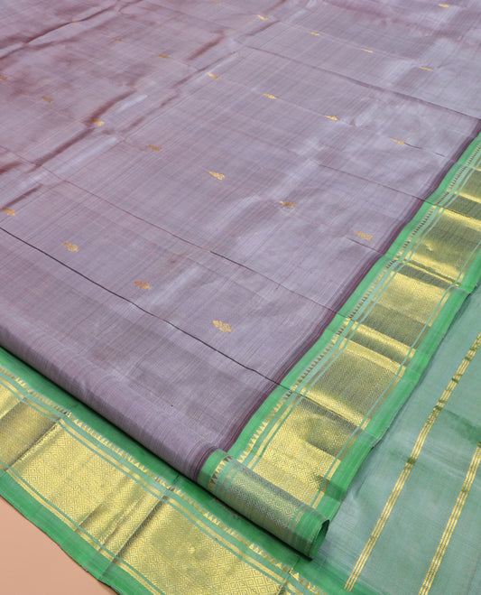 Grey Kanchipuram Silk Saree,  Detailed with Zari Buttas, a Contrast One-Sided Border of Rekku, Banaras, and Jaal Designs, Zari Design Pallu, and No Blouse