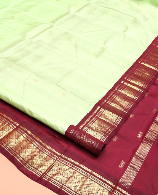 Green Kanchipuram Silk Saree, Graced with Zari Buttas, Contrast Korvai Border of Thilakam Mokku, Banaras, Muthu, and Jaal, Zari Design Pallu, and No Blouse