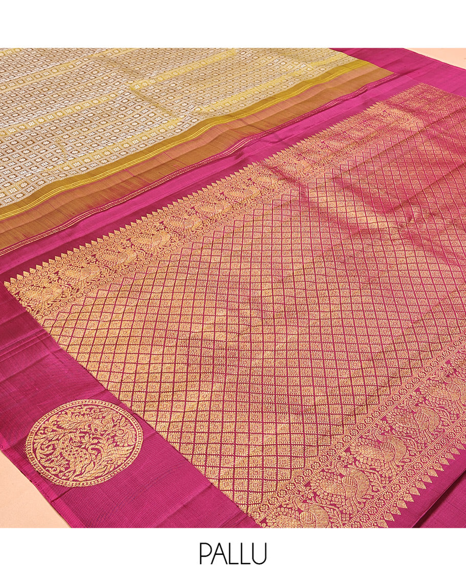 Green Embossed Parambara Silk Saree, a Contrast Border of Chakram Designs, Grand Pallu of Jaal Design, and Contrast Blouse