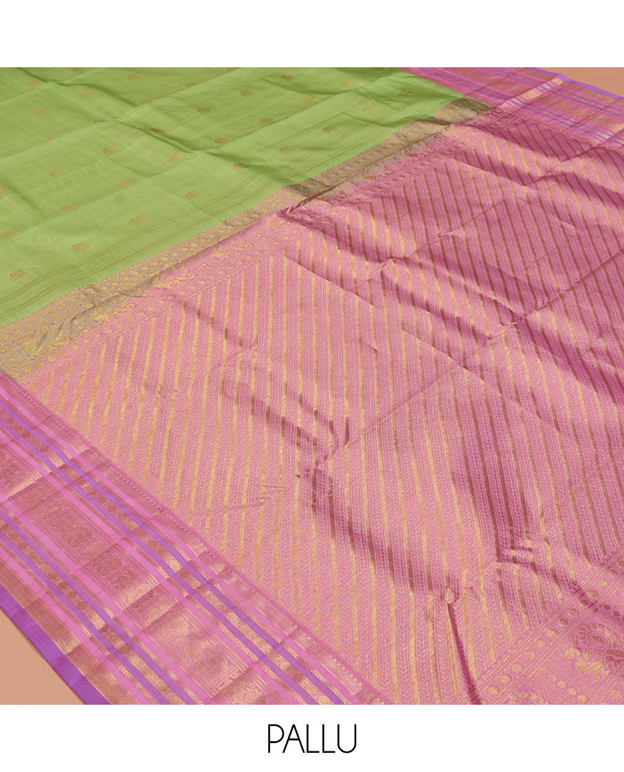 Green Vasundhara Silk Saree, Accentuated with Mayil and Chakram Buttas All Over Its Body, Complemented by a Contrast Border of Rekku, Muthu, Kathir, Poun, Mayil and Mayil Kann Designs, Grand Pallu, and Paired with a Contrast Blouse