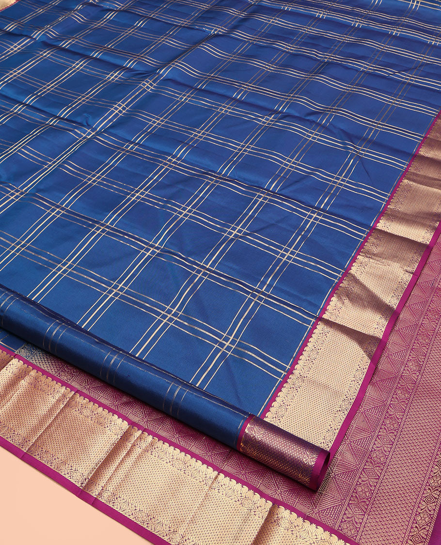 Blue Kanchipuram Silk Saree, Ornamented with Zari Checked Design on Its Body, Complemented by a Contrast Border of Manga, Rekku, Cross Kamalam, and Mayil Kann Designs, Grand Jaal Pallu, and Paired with a Contrast Blouse