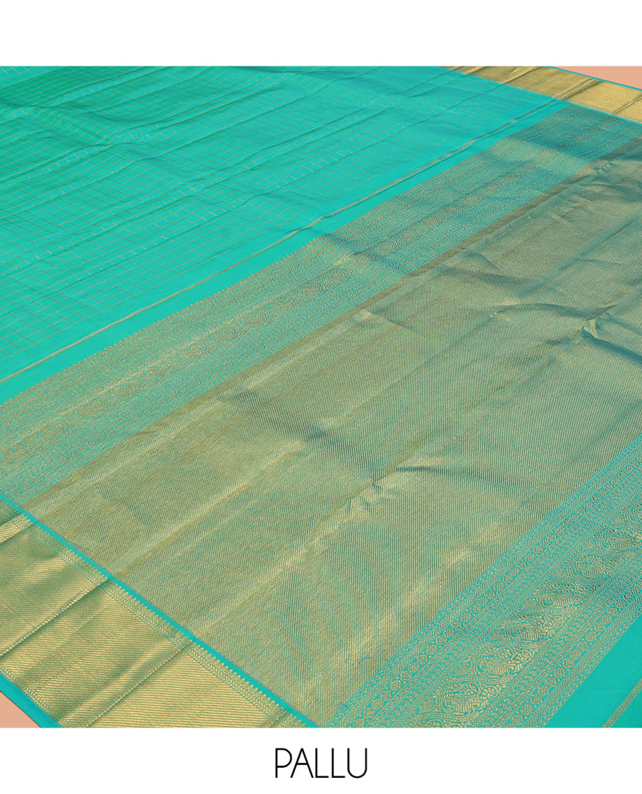 Turquoise Kanchipuram Silk Saree, Detailed with Zari Checks, and Mayil Buttas, a Zari Border of Thilakam Mokku, Kathir, and Zari Stripes, Zari Striped Pallu, and a Matching Blouse