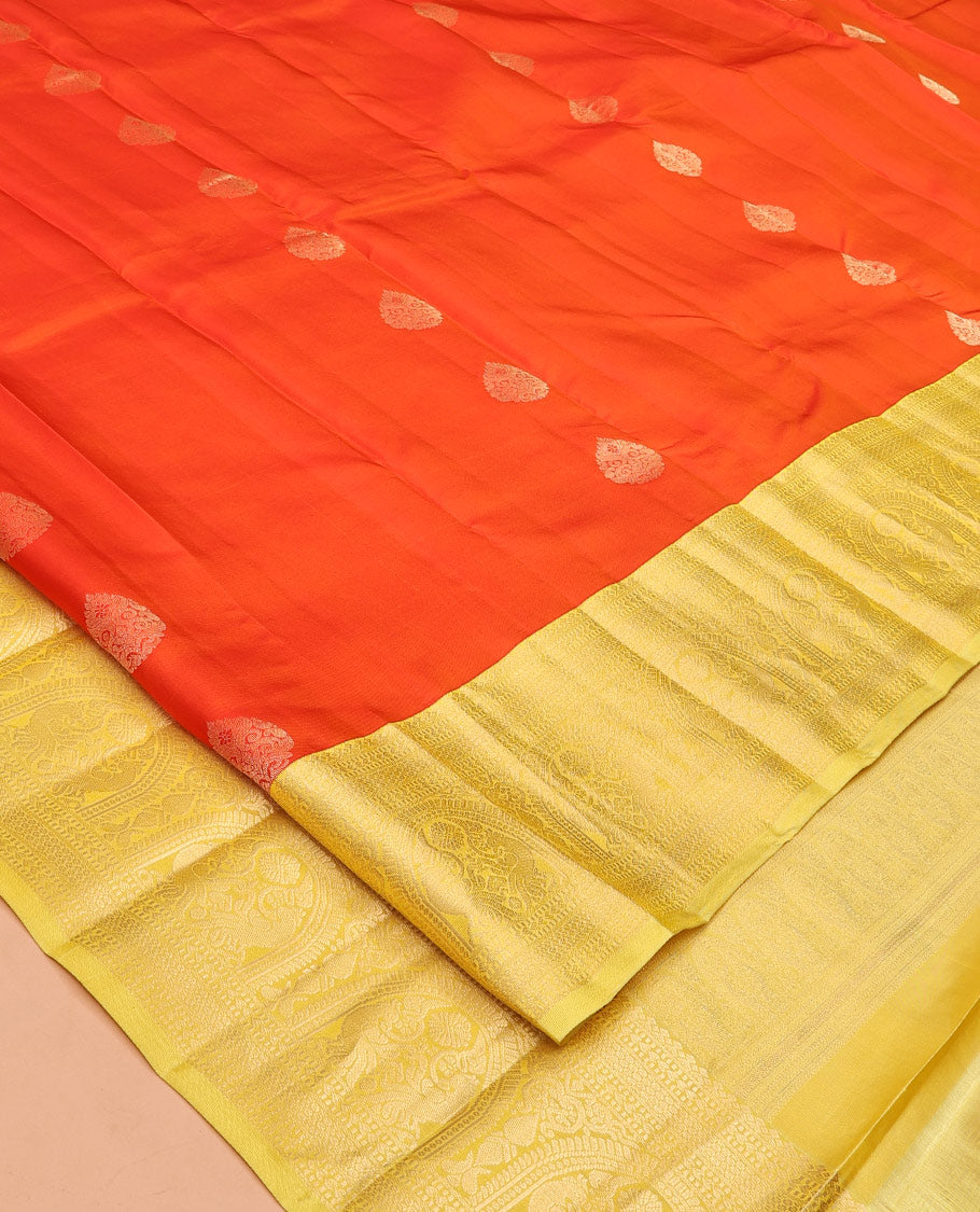 Orange Zari Buttas Vasundhara Silk Saree, Complemented by a Contrast Traditional Border of Mayil Designs, Sparsely Threaded Pallu, and a Contrast Blouse