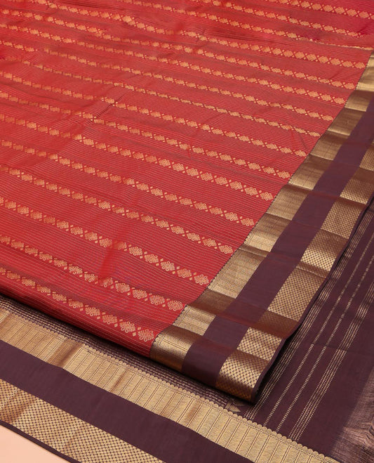 Rust Vasundhara Lite Silk Mix Saree, Bedecked with Zari Buttas and Stripes on Its Body, Complemented by a Contrast Rettai Pettu Border of Thilakam, Neli, and Paiyaadi Kattam Designs, Grandly Designed Pallu, and Paired with a Contrast Blouse