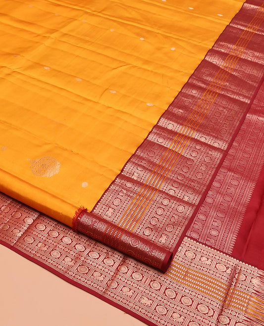 Yellow Vasundhara Silk Saree, Finely Crafted with Zari Buttas, Contrast Border of Thilakam Mokku, Muthu, Mayil, Chakram, Neli, and Kuthirai Designs, Jaal Pallu, and a Contrast Blouse