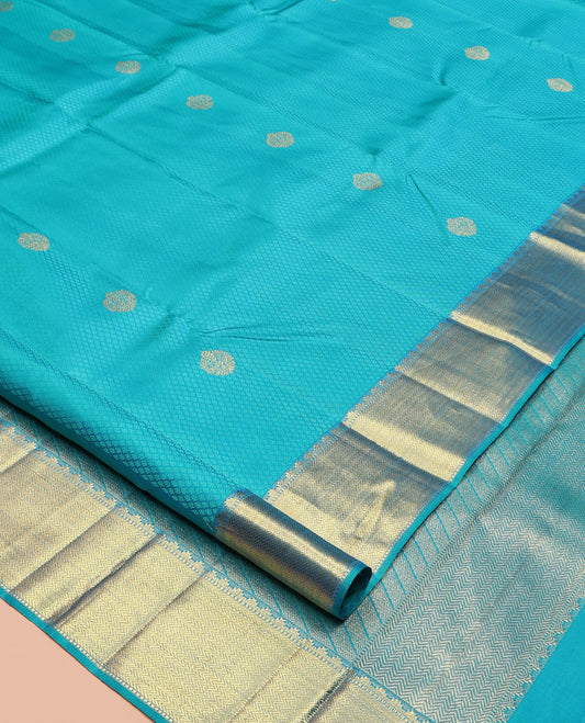 Blue Parampara Silk Saree, Adorned with Zari Buttas and Embossed Texture On Its Body, Highlighted by Zari Border of Thazampoo Rekku, Muthu, and Vanki Designs, Pallu Features Vanki Designs and Paired with a Matching Blouse