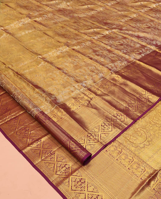 Gold Kanchipuram Tissue Silk Saree, Spotlighted with Jacquard Designs on Its Body, Complemented by a Contrast Border of Thilakam Mokku, Kamalam, Mayil, Mayil Kann, and Diamond Designs, Intricately Designed Pallu, and Paired with a Contrast Blouse