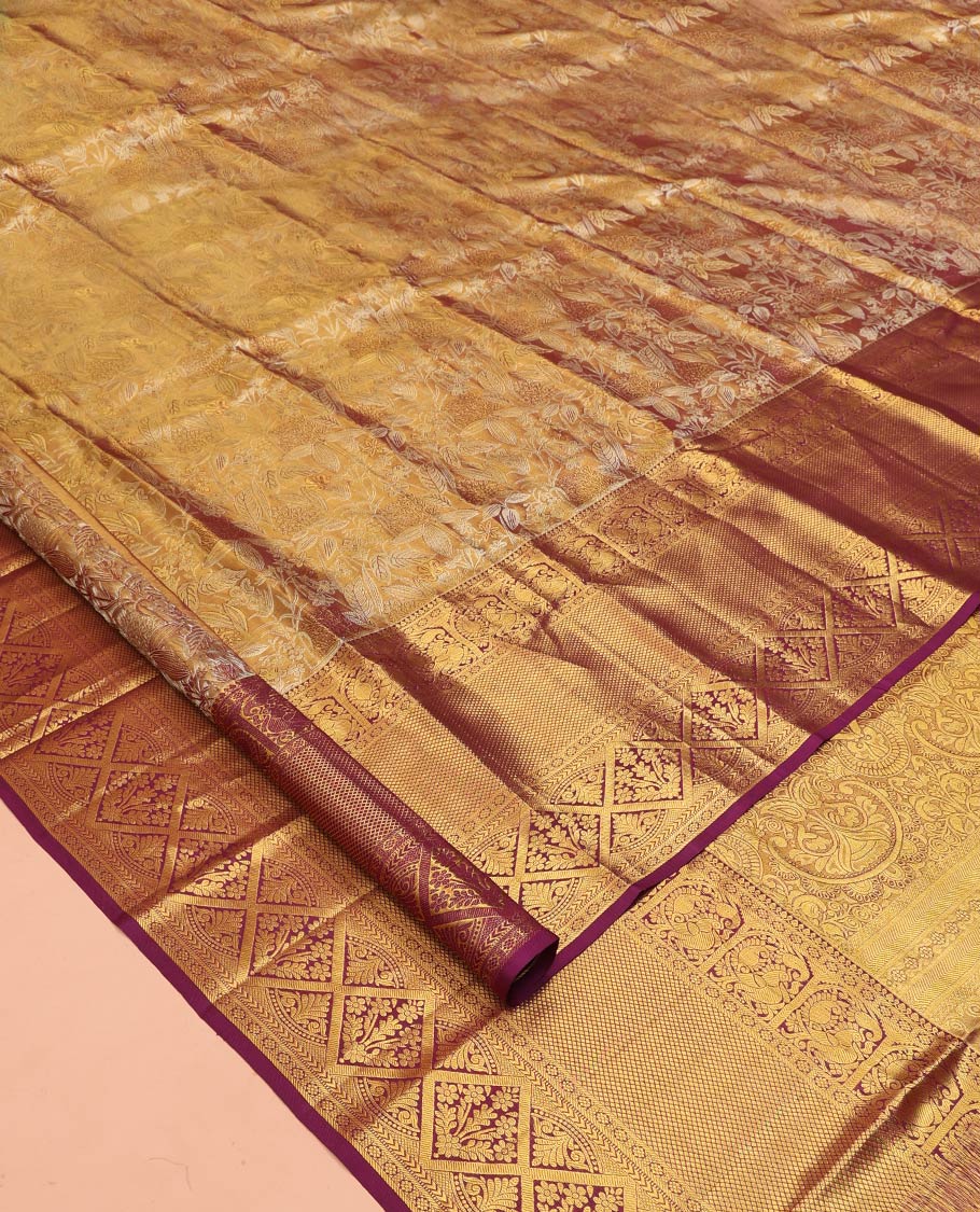 Gold Kanchipuram Tissue Silk Saree, Spotlighted with Jacquard Designs on Its Body, Complemented by a Contrast Border of Thilakam Mokku, Kamalam, Mayil, Mayil Kann, and Diamond Designs, Intricately Designed Pallu, and Paired with a Contrast Blouse