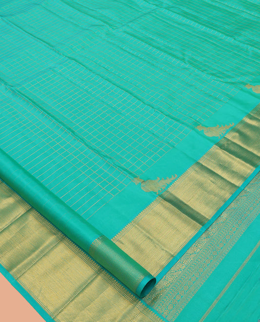 Turquoise Kanchipuram Silk Saree, Detailed with Zari Checks, and Mayil Buttas, a Zari Border of Thilakam Mokku, Kathir, and Zari Stripes, Zari Striped Pallu, and a Matching Blouse