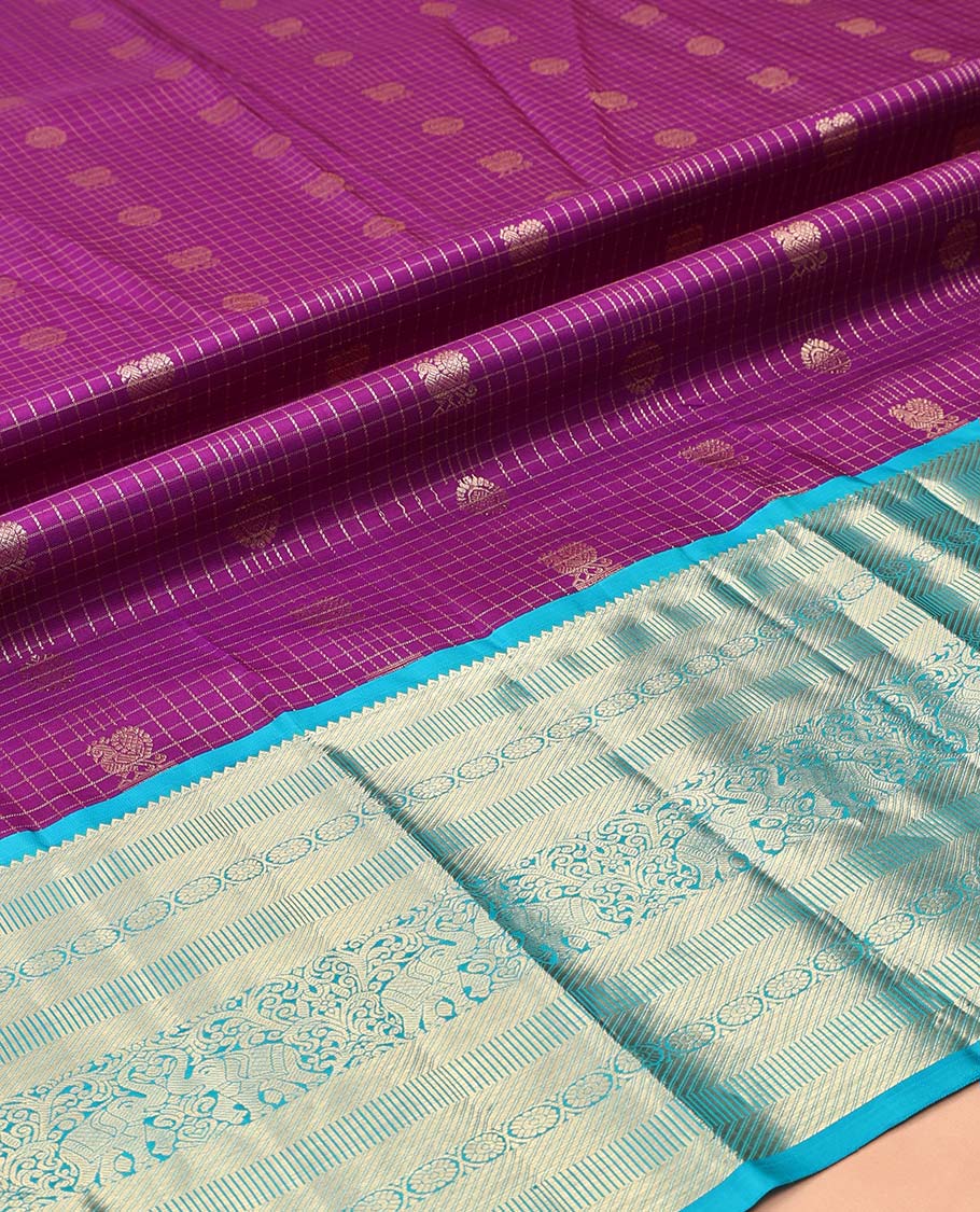 Purple Pure Silk Half-Saree, Masterfully Woven with Mayil-Chakram Buttas and Micro-Checks on Its Skirt, Complemented by a Contrast Border of Rekku, Chakram, and Yaanai Designs, Comes with a Contrast Blouse and a Dhavani of Intricate Designs
