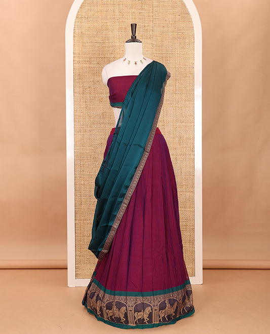 Magenta with green mercedised cotton half-saree, contrast elephant zari border skirt, matching blouse & one side border georgette dhavani