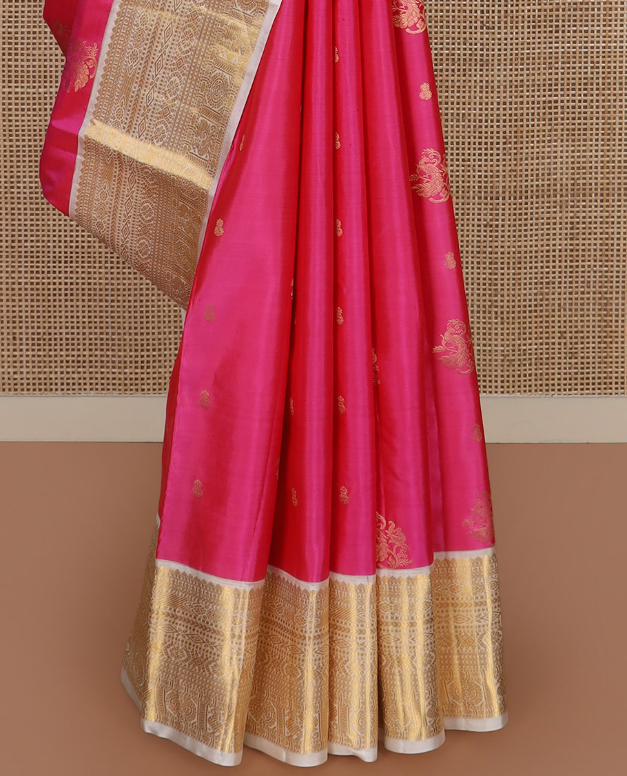 Pink zari buttas silk saree, contrast border of thilakam, diamond, laddu kamalam, muthu, kathir, mayil and chakram designs, and jaal pallu