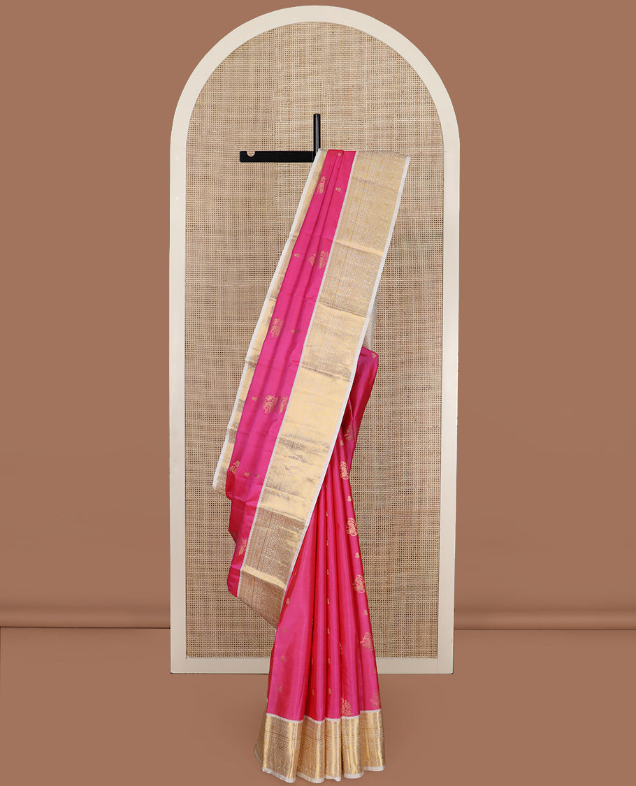 Pink zari buttas silk saree, contrast border of thilakam, diamond, laddu kamalam, muthu, kathir, mayil and chakram designs, and jaal pallu