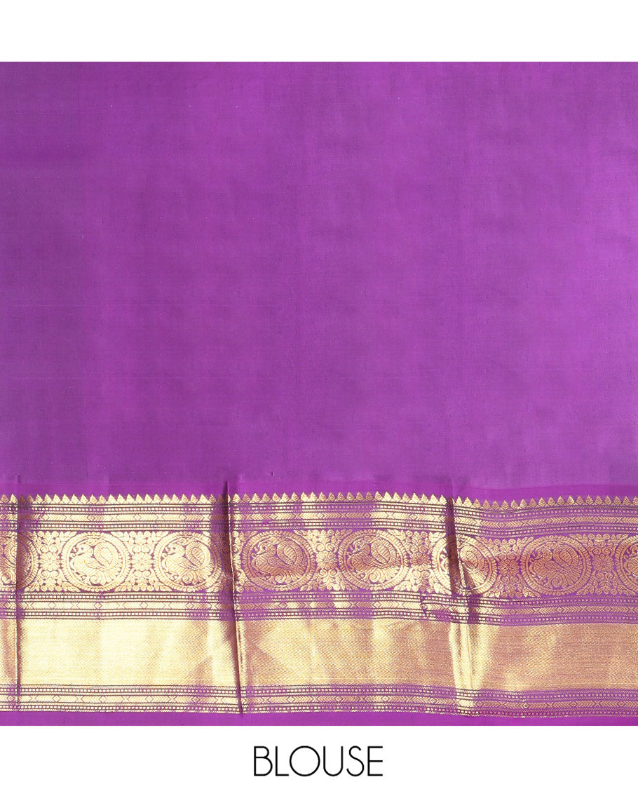 Parrot Green Vasundhara Silk Saree, Enriched with Sparse Stripes and Zari Buttas, Complemented by a Contrast Border of Thilakam, Banaras, Muthu, and Round Mayil Designs, Pallu Steeped with Traditional Designs, and Paired with a Contrast Blouse