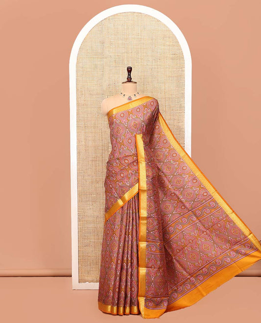 Orange Printed Silk Saree, Ornamented with Intricate Designs, Highlighted by a Traditional Zari Border, Printed Pallu, and a Matching Blouse