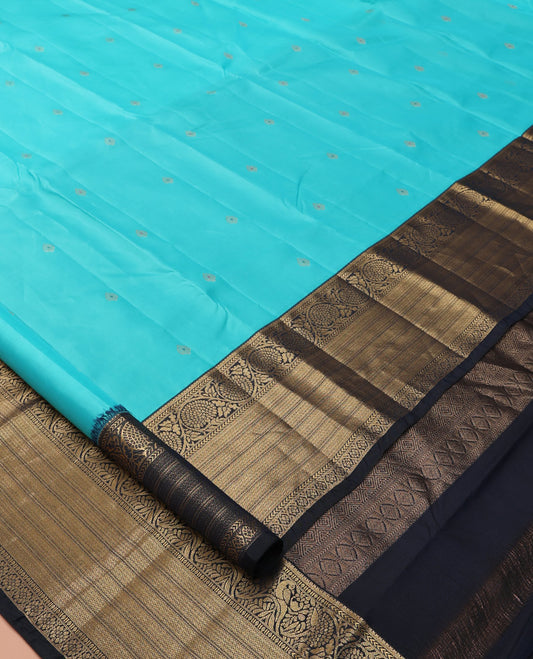 Blue Vasundhara Lite Silk Mix Saree, Accentuated with Zari Buttas, a Contrast Border of Kathir, Mayil Kann, and Kodi Visiry Designs, Jaal Pallu, and a Contrast Blouse