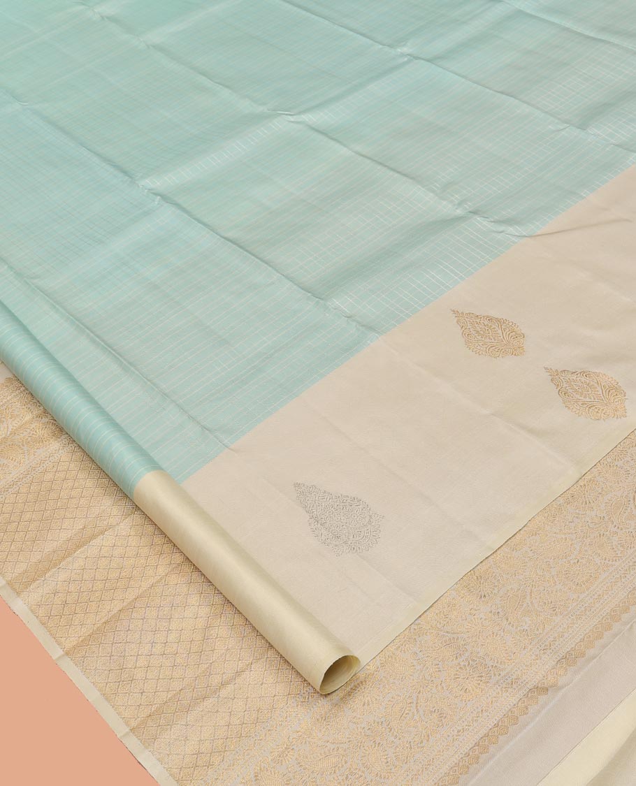 Pale Blue Kanchipuram Silk Saree, Sparsely Woven with Checks, Complemented by a Contrast Zari Buttas Woven Border, Jaal Pallu, and Contrast Blouse