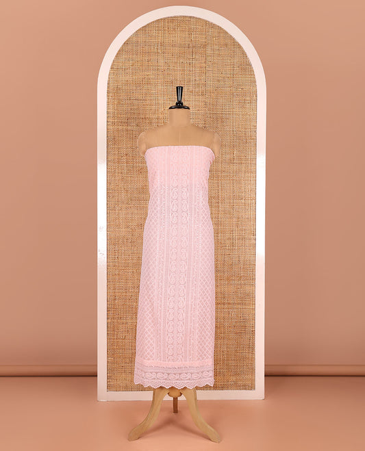 Light peach material chudidar set, paisleys and jaal schiffli sequins embroidered mul georgette top, a matching bottom, and a mirror work dupatta