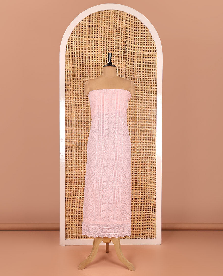 Light peach material chudidar set, paisleys and jaal schiffli sequins embroidered mul georgette top, a matching bottom, and a mirror work dupatta