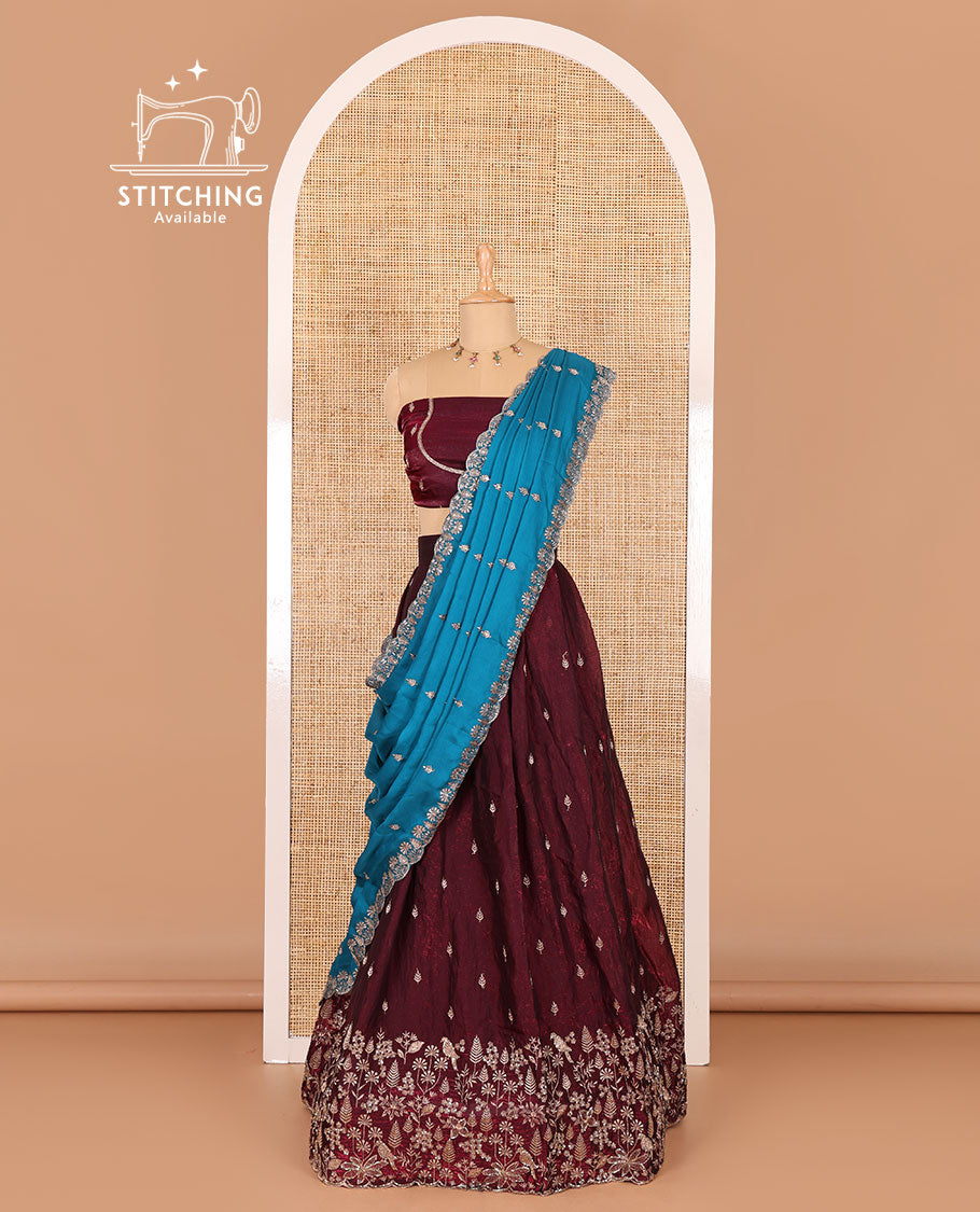 Wine half-saree, floral and bird motifs embroidered velvet organza top, matching embroidered blouse, and contrast scallop embroidered syska georgette dhavani