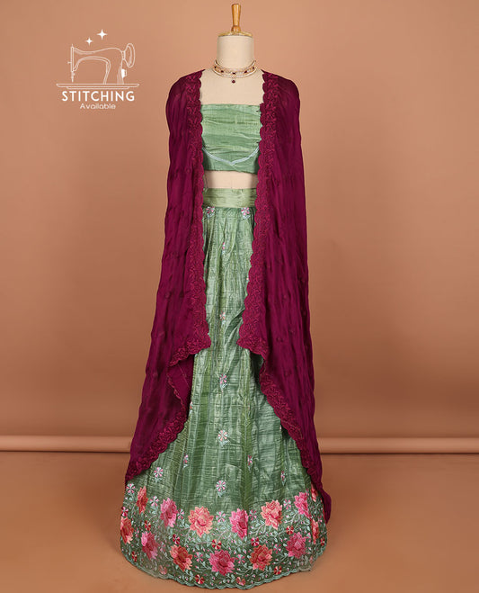 Green buttas half saree with contrast border , zari design blouse & floral buttas , scallop border dhavani
