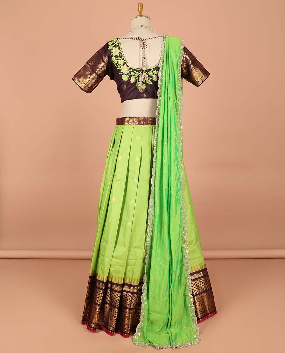 Green buttas semi-stitched half saree with contrast zari border,  embroidered blouse & scallop border dhavani