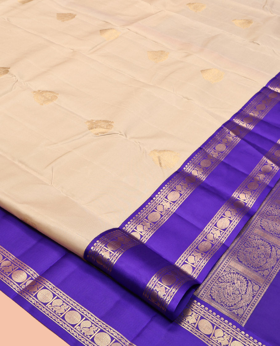 Cream Vasundhara Lite Silk Mix Saree, Subtly Sparkled with Zari Buttas, a Contrast Rettai Pettu Border of Thilakam Mokku, Neli, Mayil, and Poun, Intricate Pallu, and a Contrast Blouse