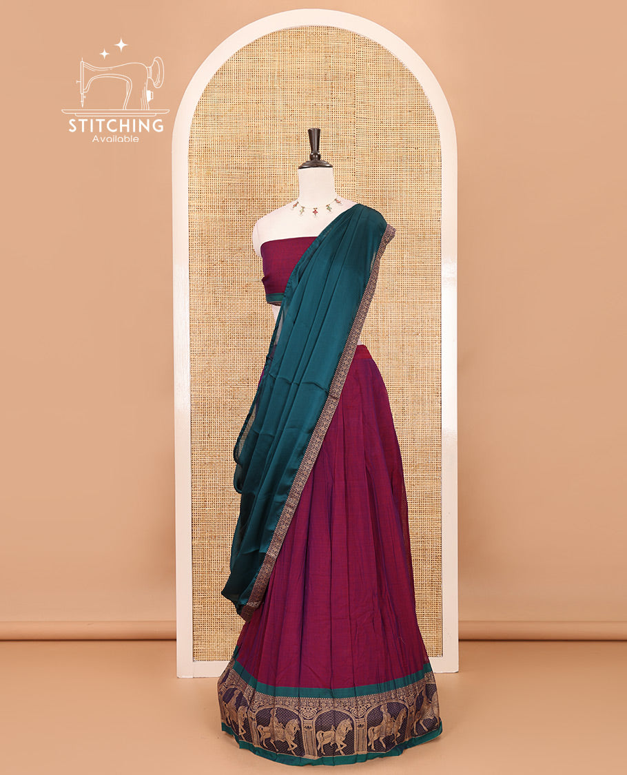 Magenta with green mercedised cotton half-saree, contrast elephant zari border skirt, matching blouse & one side border georgette dhavani