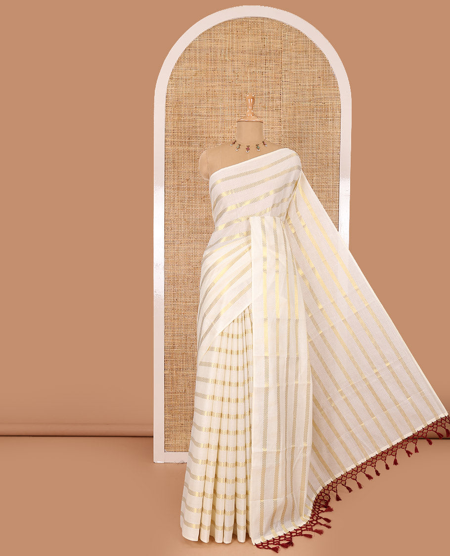 Borderless cream and maroon horizontal zari muthu striped Kerala cotton saree, self-pallu with tassels and a matching blouse