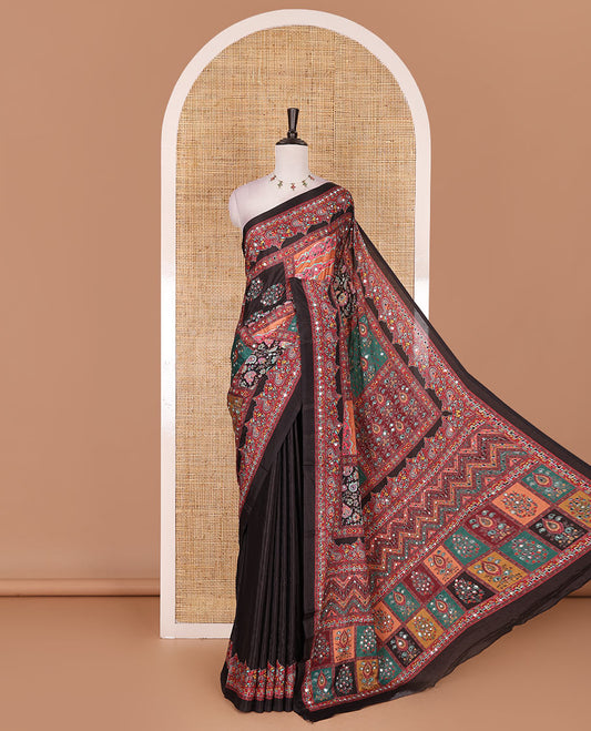 Black kaleidoscopic colored floral-geometric printed with mirrorwork masakali saree, printed border, print with mirror work pallu, and a matching blouse