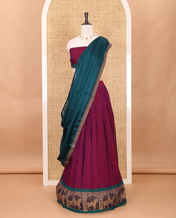 Magenta with green mercedised cotton half-saree, contrast elephant zari border skirt, matching blouse & one side border georgette dhavani