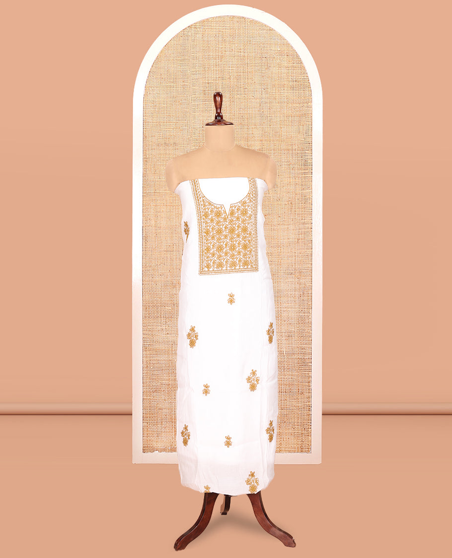 White-Mustard Mul Chanderi Material Churidar Features a Floral-Themed Thread-Embroidered Top, a Plain Santoon Bottom, and Thread Embroidered Dupatta