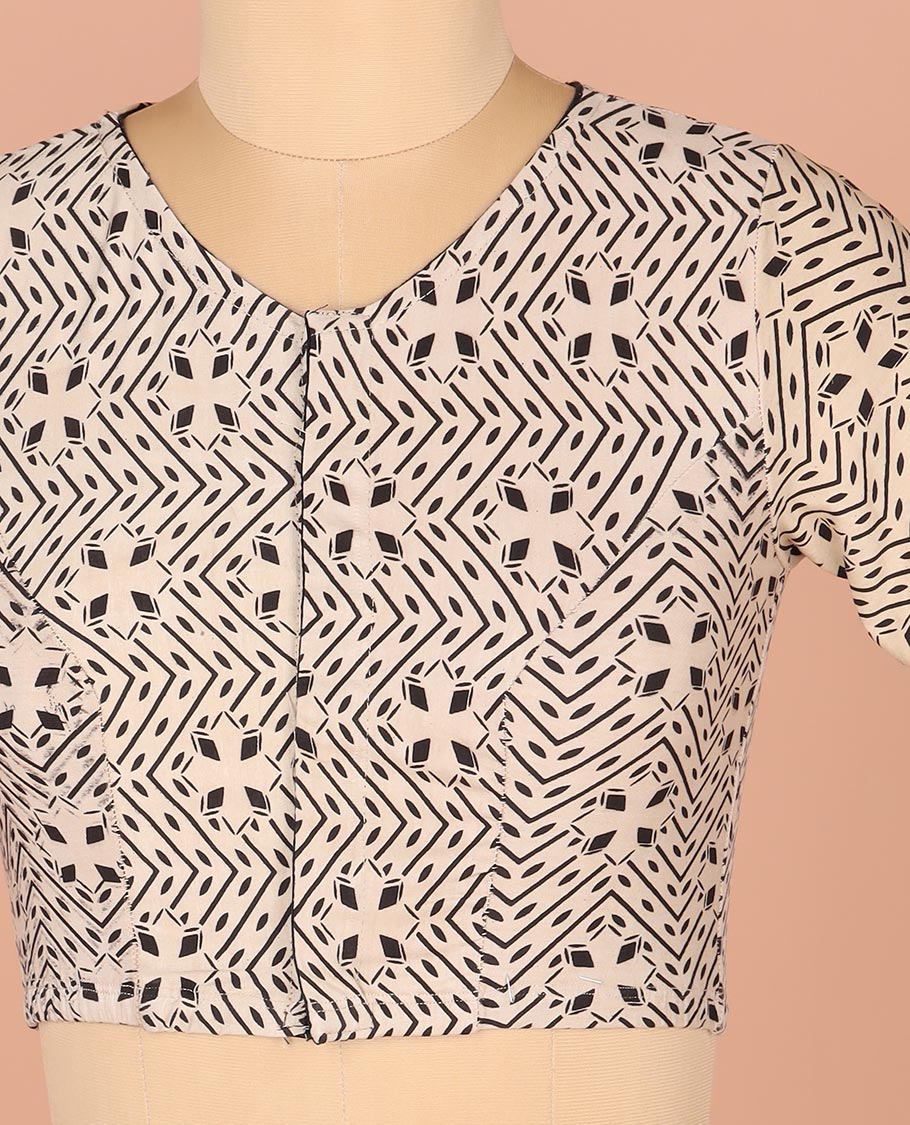 Off-White Readymade Blouse Prettified with Geometric Prints, Featuring a Front Round-Neck, a Back Closed Neck, and Elbow Sleeves