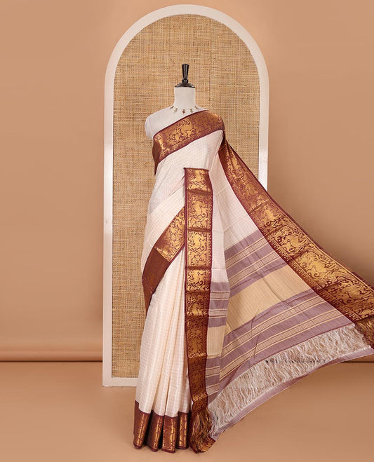 Half-white zari checked semi-taffeta silk saree, contrast maroon deer motifs woven border, striped pallu & contrast striped zari border blouse