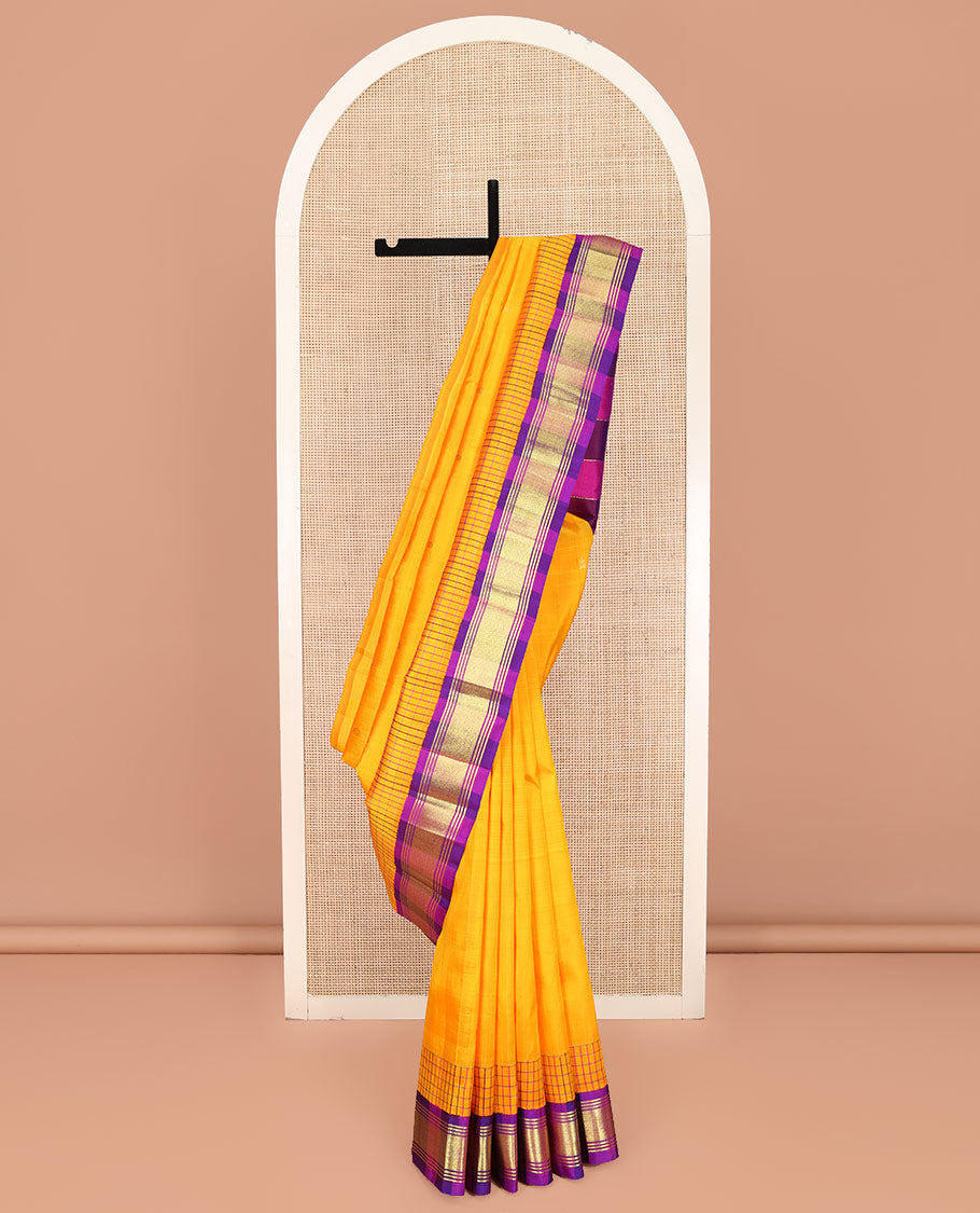 Yellow Kanchipuram Silk Saree, Bedecked with Zari Buttas on Its Body, Complemented by Contrast One-Sided Korvai Border of Banaras, and Mayil Kann Designs, Pallu Features Zari Designs, and Comes Without a Blouse
