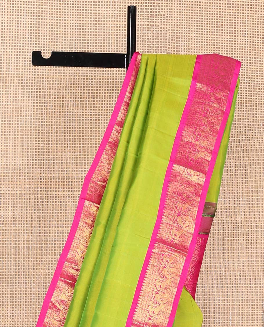 Green plain Kanchipuram korvai silk saree, contrast neer korvai border of thilakam mokku, kathir, poun, and mayil kann designs, and jaal pallu