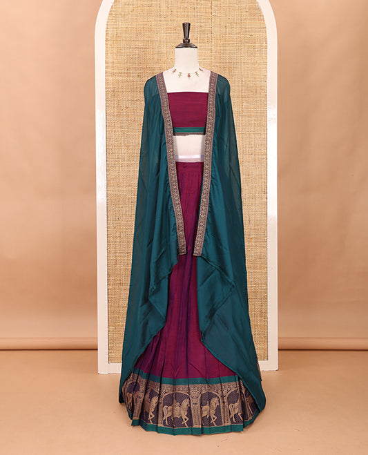 Magenta with green mercedised cotton half-saree, contrast elephant zari border skirt, matching blouse & one side border georgette dhavani