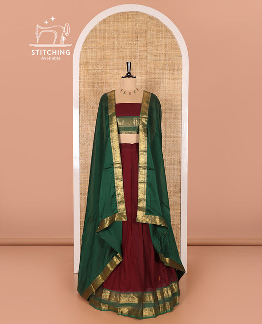 Maroon and Green Chettinad Cotton Half-Saree Featuring Buttas Woven Skirt, Highlighted with a Contrast Rettai Pettu Peacock Motifs Woven Zari Border, a Subtly Woven Matching Blouse, and a Vichitra Silk Contrast Traditional Zari-Bordered Dhavani