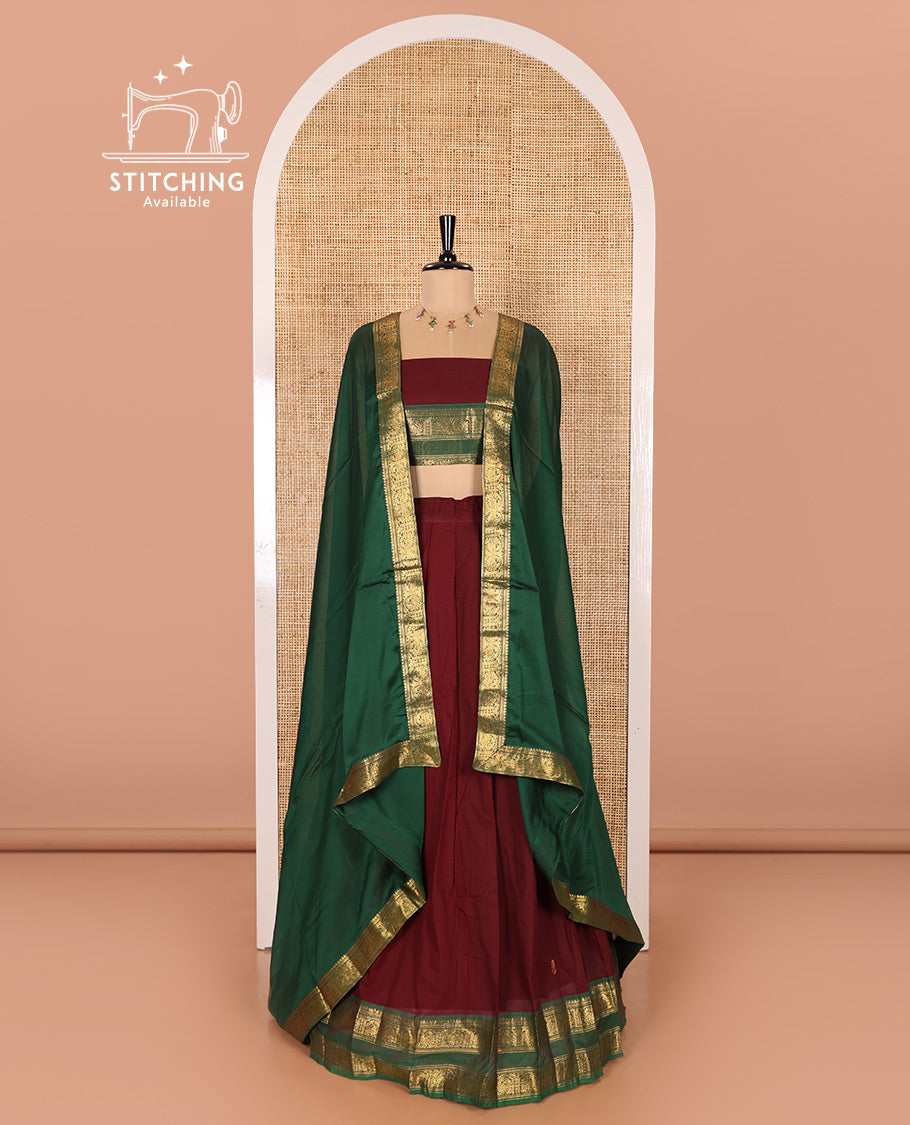 Maroon and Green Chettinad Cotton Half-Saree Featuring Buttas Woven Skirt, Highlighted with a Contrast Rettai Pettu Peacock Motifs Woven Zari Border, a Subtly Woven Matching Blouse, and a Vichitra Silk Contrast Traditional Zari-Bordered Dhavani