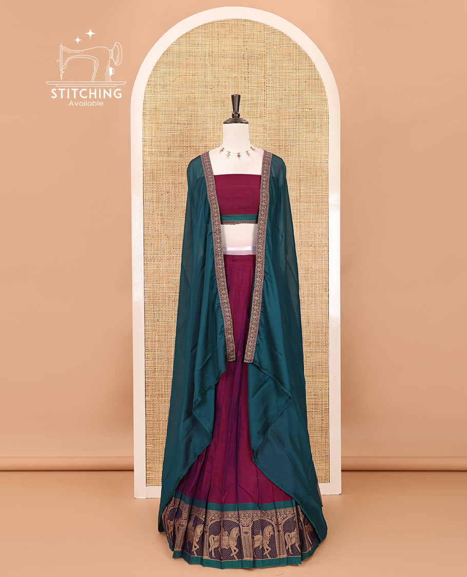 Magenta with green mercedised cotton half-saree, contrast elephant zari border skirt, matching blouse & one side border georgette dhavani