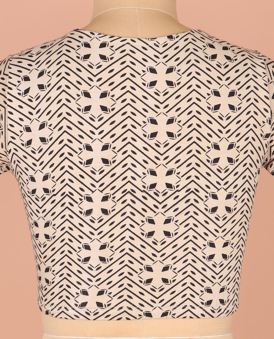 Off-White Readymade Blouse Prettified with Geometric Prints, Featuring a Front Round-Neck, a Back Closed Neck, and Elbow Sleeves