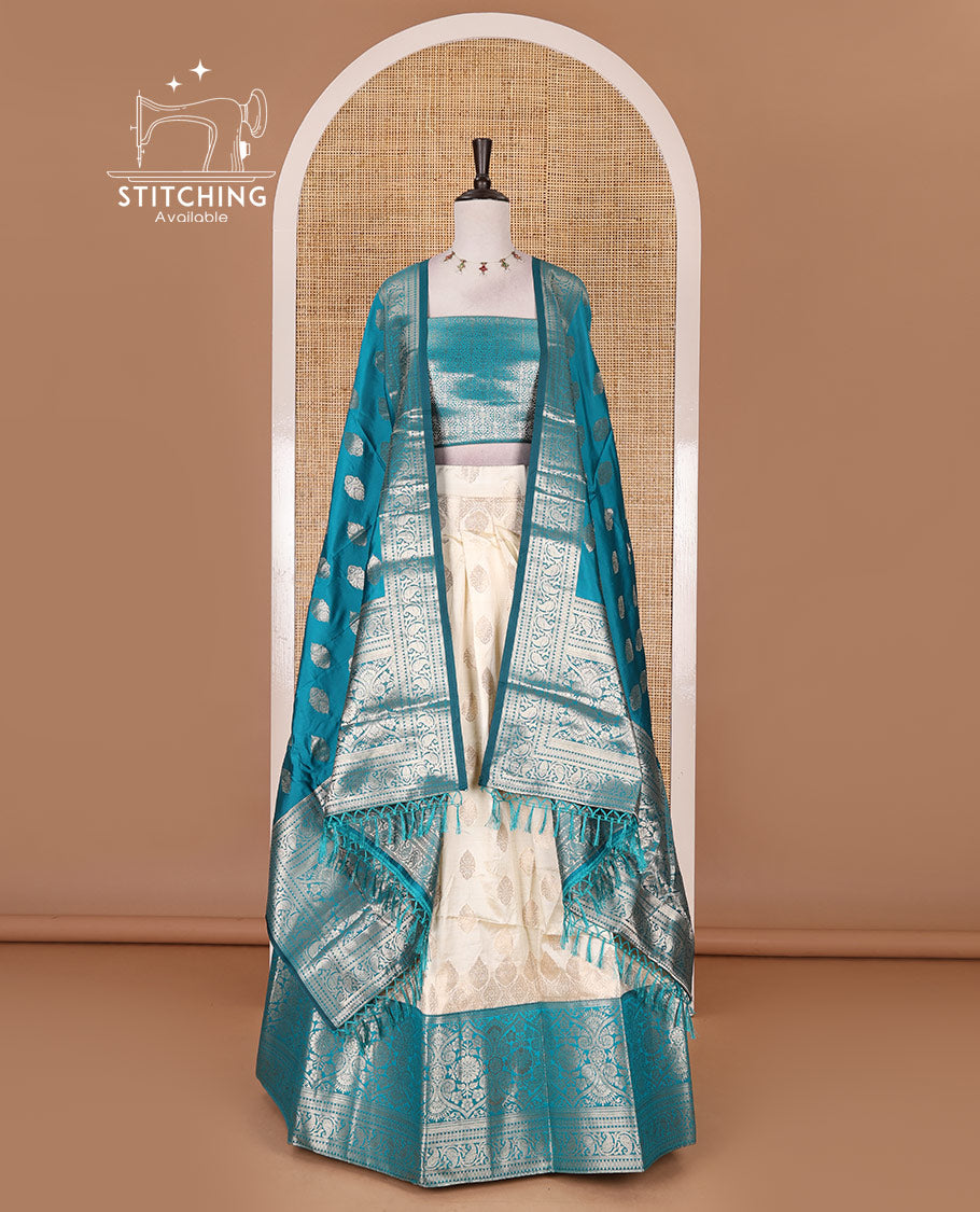 Cream with rama green semi-banarasi half-saree, zari buttas with contrast traditional zari border skirt, zari jacquard blouse, and zari design dhavani