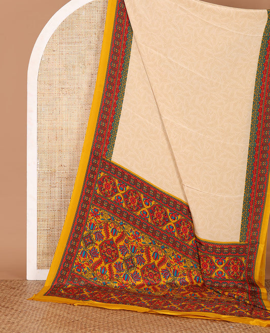 Cream leaf motifs printed crepe silk saree, contrast yellow printed blouse, kaleidoscope coloured intricately printed border & pallu