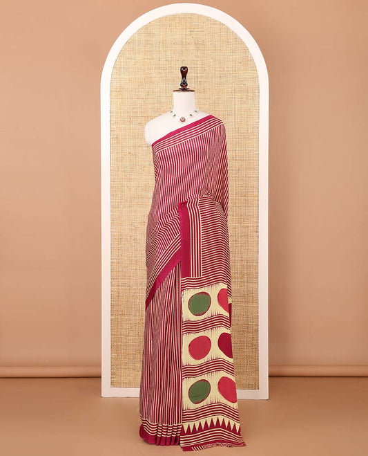 Magenta vertical stripes printed modal satin saree, a self-border of horizontal stripes print, polka dots printed on the pallu, and an intricate ajrakh-style printed blouse