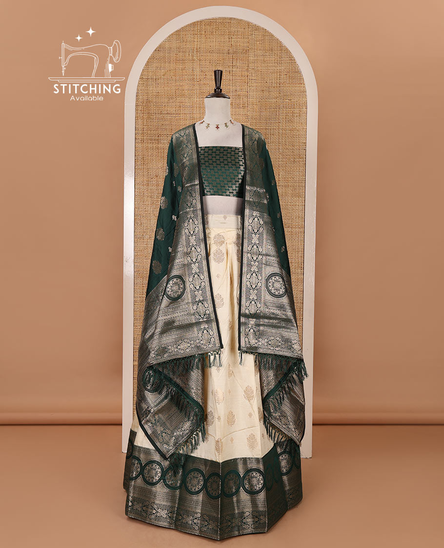 Cream-bottle green semi-banaras half-saree, zari buttas & contrast traditional zari border skirt, jacquard blouse & intricately zari woven dhavani