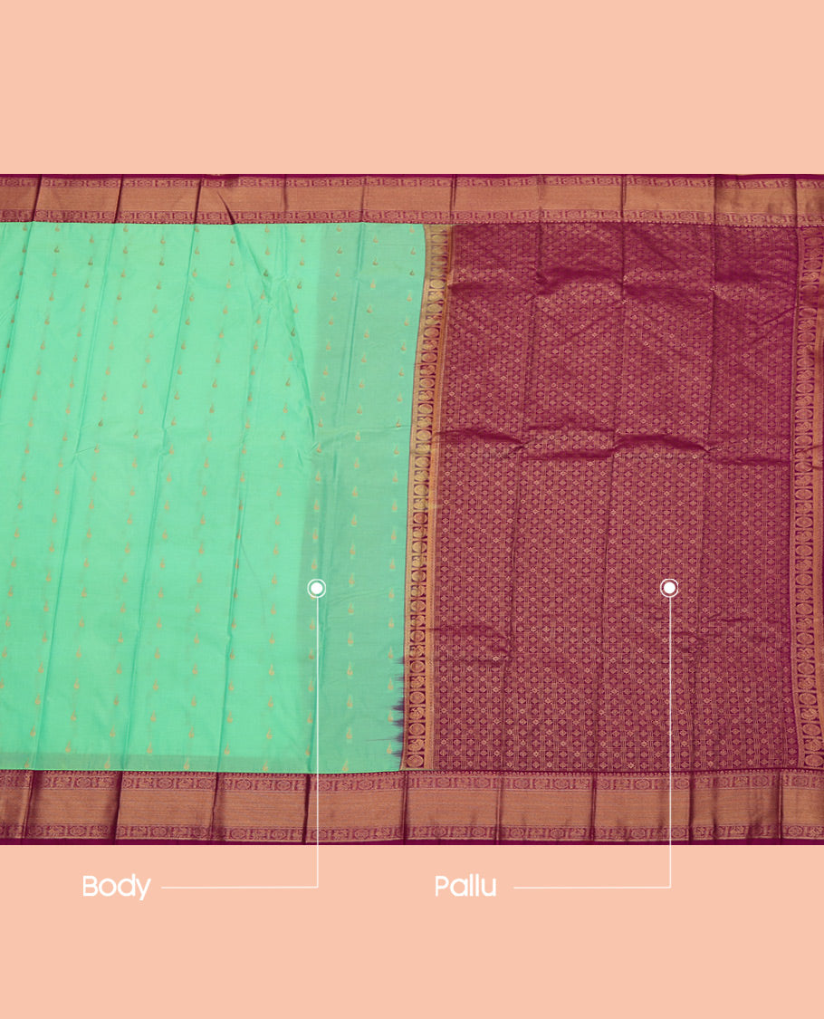 Green Budget Silk Saree, Elevated with Zari Buttas All Over Its Body, Complemented by a Contrast Traditional Peacock-Chakram Zari Border, Grand Butta Enclosed Checked Pallu, and Paired with a Contrast Blouse