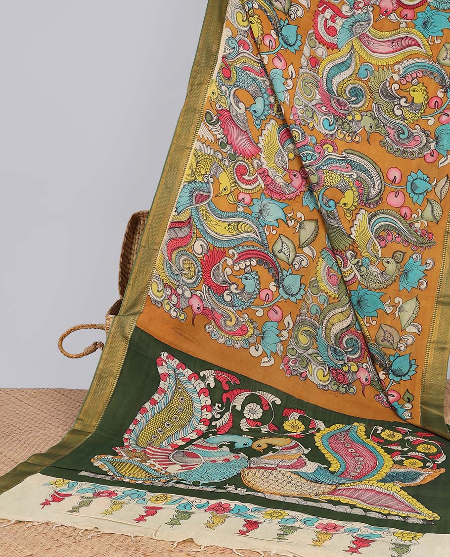 Mustard floral,peacock design handpainted pen kalamkari silk saree with contrast zari border & peacock design pallu