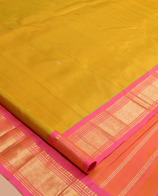 Green Kanchipuram Silk Saree, Sparsely Woven with Zari Buttas, a Contrast One-Sided Border of Panner Sombu, Banaras, Muthu, and Mayil Kann Designs, Zari Design Pallu, and No Blouse