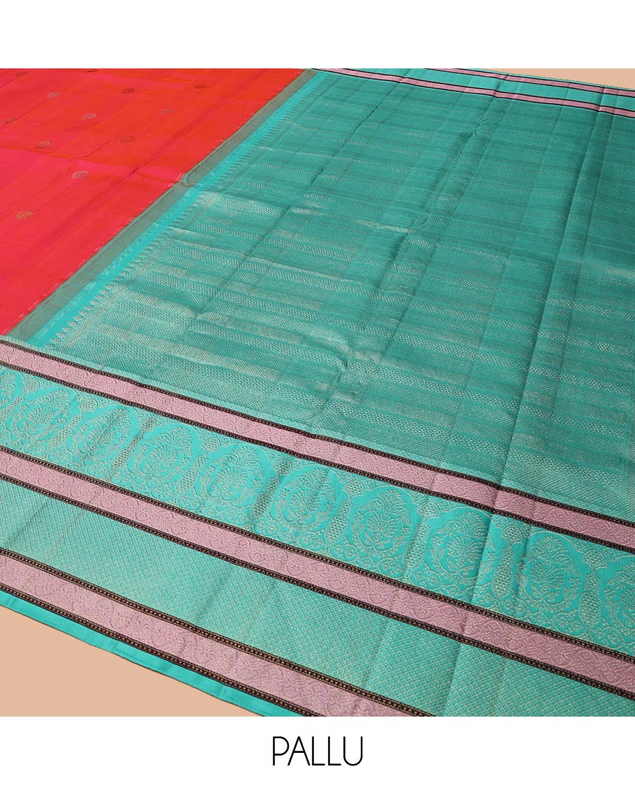 Red Kanchipuram Designer Silk Saree, Subtly Adorned with Buttas All Over Its Body, Complemented by a Captivating Contrast Border of Mughal-Style Designs, Geometric-Patterned Zari-Woven Pallu, and Paired with a Contrast Blouse